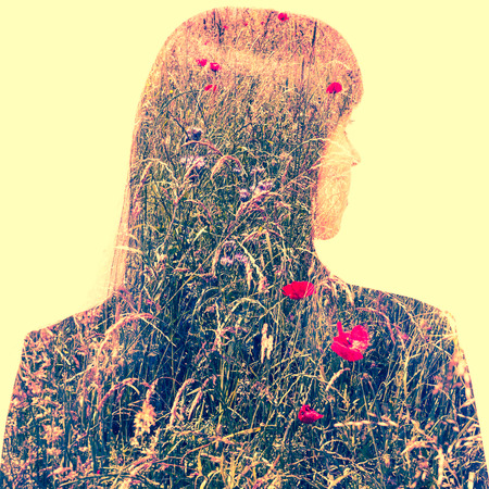 Double exposure portrait of a  business woman with meadow inside.の写真素材