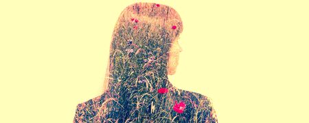 Double exposure portrait of a  business woman with meadow inside.の写真素材