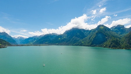 Mountain range of the Alps and lake in Switzerland. Aerial view.の写真素材
