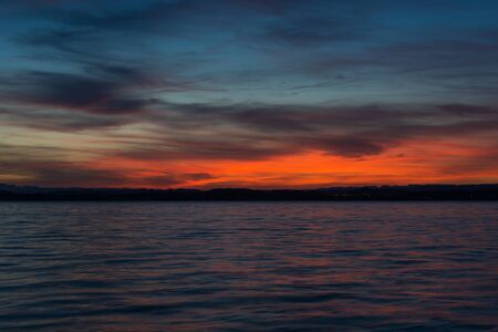 Dramatic sunset over lake.の写真素材