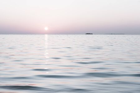 Gentle color of sunset on a tropical island. Relax evening in the Maldives. Bleach Bypass effectの写真素材