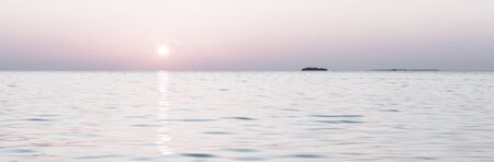 Gentle color of sunset on a tropical island. Relax evening in the Maldives. Bleach Bypass effectの写真素材