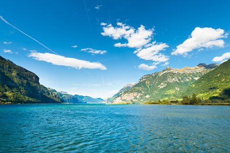 Mmountain range of the Alps. Foehn wind over the lake.  Grandiose volumetric  panorama.の写真素材