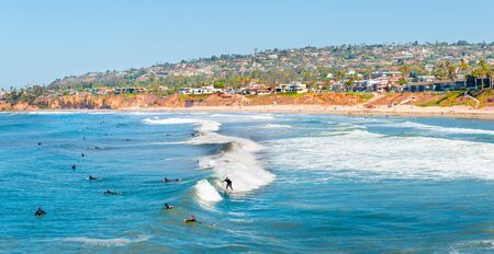 Coast San Diego, California. Surfers in the ocean waiting for a wave.のeditorial素材