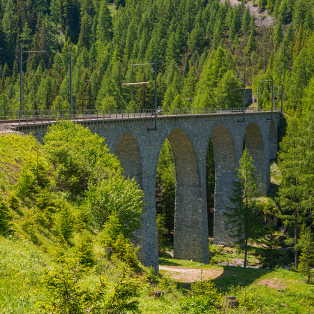 Swiss Alps stone bridge of the Albula Railway. Unesko World Heritage.の写真素材