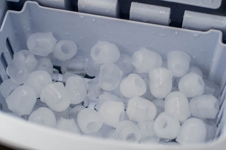 Close-up of white plastic beads in a plastic box. Select focus.の写真素材