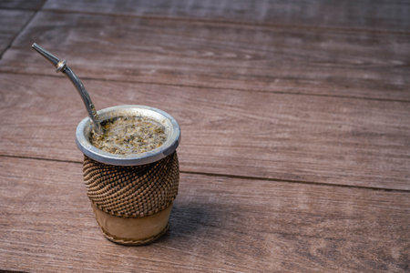 Coffee in a cup on a wooden background with copy spaceの写真素材