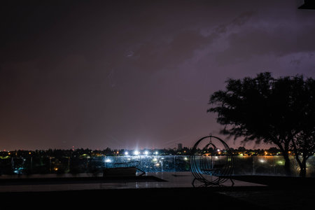 Night view of the swimming pool in the center of the city.の写真素材