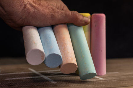 Colorful chalks on a wooden table. Select focus.の写真素材