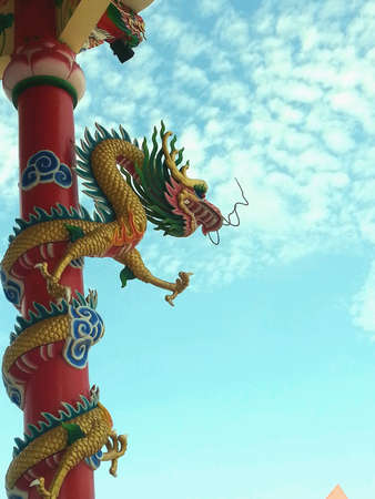 Dragon statue under blue sky in temple thailand.の素材