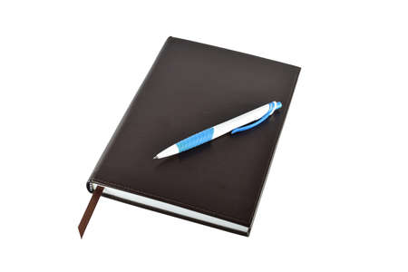 Pen and book on white background with clipping paths.の写真素材