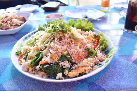 fried rice in dish on table.