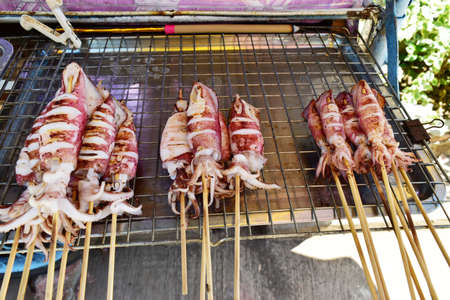 Grilled squid on the grillの写真素材