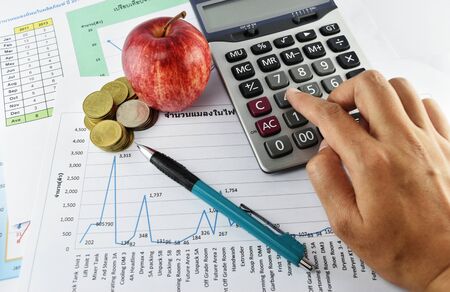 woman hand with calculator placed on document., concept for business