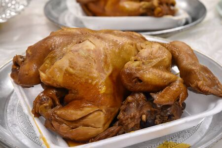 Boiled chicken with fish sauce on white plate.の写真素材