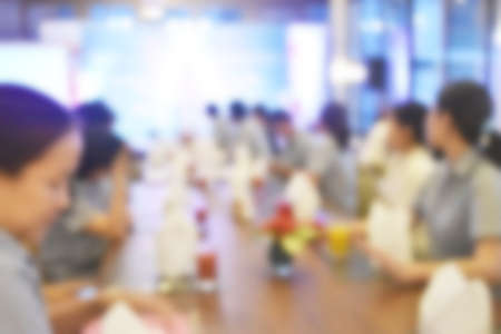 Abstract blur people in restaurant with light bokeh background, party lifestyle.の写真素材
