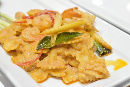 Curry fried shrimp or prawn with coconut milk and Kaffir lime leaf, lemongrass leaf, carrot slice,  thailand food style.の写真素材
