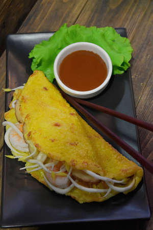 pancakes with sauce on plate.の写真素材