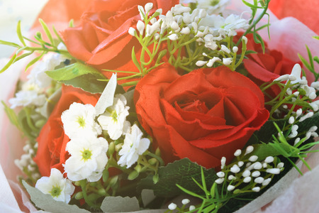 Red roses bouquet put on wooden background. Concept for Valentine's day, Birthday or Wedding.の写真素材