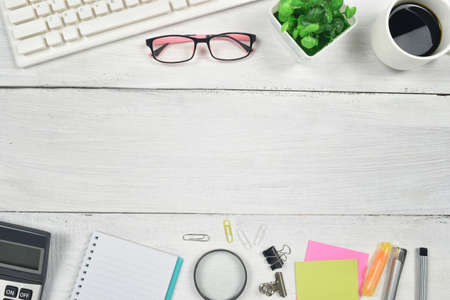 Office supplies on white wooden background. copy space. top view.の写真素材