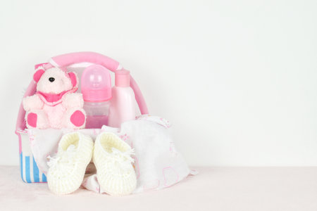 Newborn goods and accessories for baby on white background with copy space.の写真素材