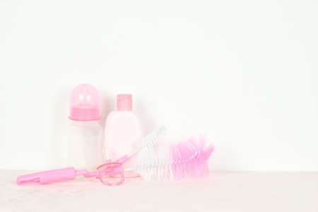Newborn goods and accessories for baby on white background.