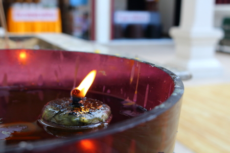 thai candle with flame for pray in buddhismの写真素材