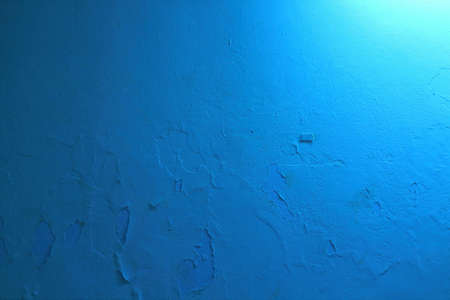 cracked wall background blue toneの写真素材