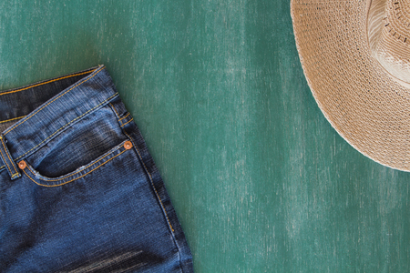 jean and hat with chalkboard backgroundの写真素材