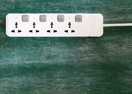Adapter power plug with chalkboard backgroundの写真素材