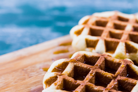 sweet waffle with honey topping and many of copy spaceの写真素材