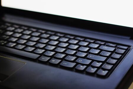 Laptop computer is turned on in a dark place. Using a laptop computer in low light negatively...