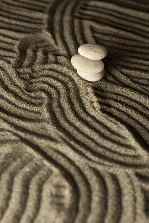 three stones in the sandの写真素材