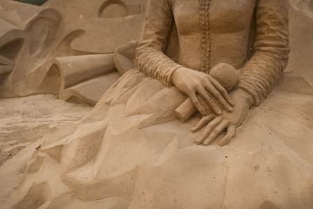 ALGARVE, PORTUGAL - August 6, 2015:  hands sand sculpture of unidentified artist at FIESA, International Sand Sculpture Festival in Algarve, Portugal.のeditorial素材