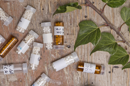 bottles with homeopathy globules and homeopathy liquid