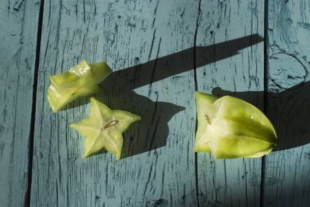 Carambola Plant, Star Fruit (Averrhoa carambola L.) fruit of Thailand medicinal properties.Carambola Plant, Top view star Fruit over old  blue wood deskの写真素材