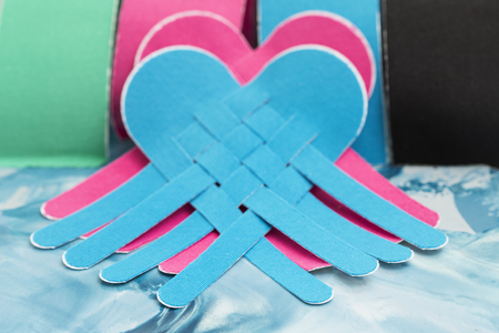 This kind of taping is called "Kinesiotape". Its purpose is to detonisize the muscle to reduce pain. In some cases you can also tonisize the muscle.の写真素材