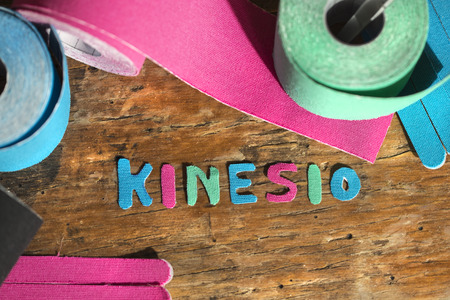 This kind of taping is called "Kinesiotape". Its purpose is to detonisize the muscle to reduce pain. In some cases you can also tonisize the muscle.の写真素材