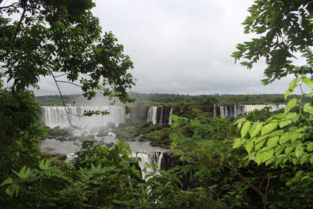 amazing view of the waterfalls and several trees at the IguaÃ§u park, ParanÃ¡. Brazilのeditorial素材