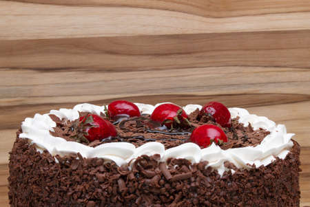 top view of a delicious cake wiht a wood backgroundの写真素材