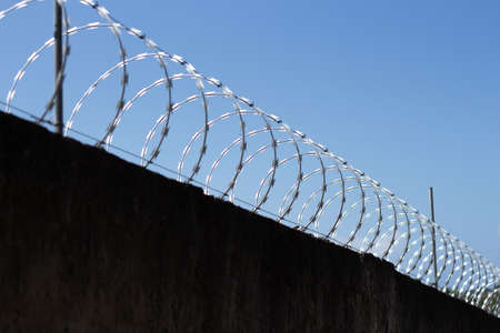 metal fence on a wall on a sunny day