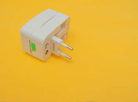 universal socket adapter with colored backgroundの写真素材