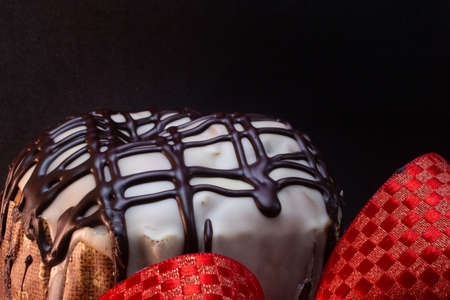 panettone with a red tie with a black backgroundの写真素材