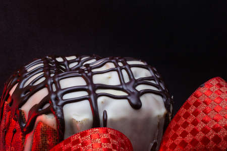 panettone with a red tie with a black backgroundの写真素材