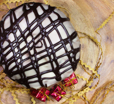top view of Panettone on a wooden table surrounded by Christmas ornamentsの写真素材
