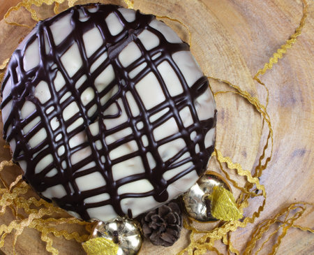 top view of Panettone on a wooden table surrounded by Christmas ornamentsの写真素材