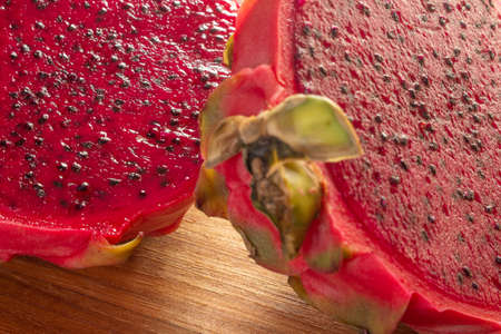 pitaya fruit slices on a wooden table.の写真素材