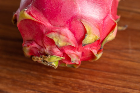 a pitaya fruit on a wooden tableの写真素材