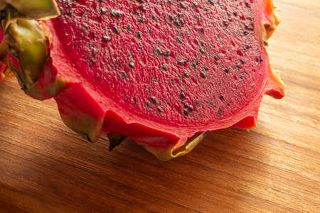 pitaya fruit slices on a wooden table.の写真素材
