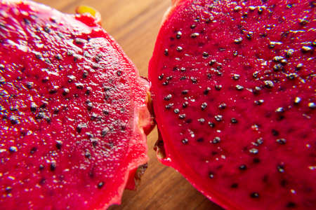 pitaya fruit slices on a wooden table.の写真素材